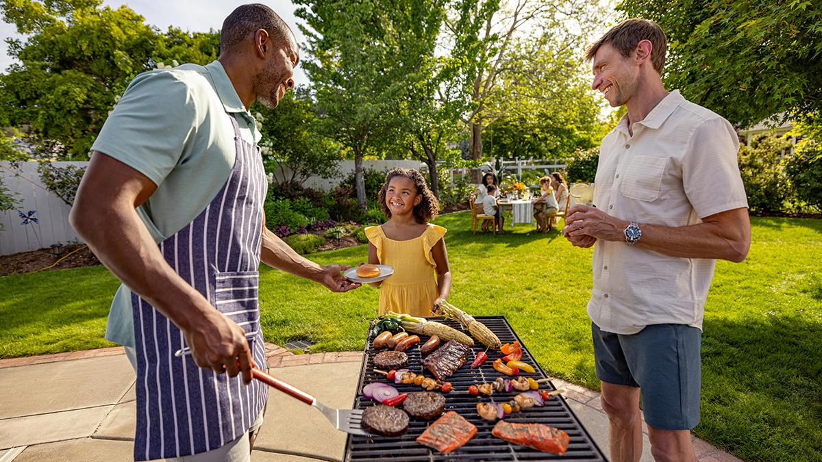 how-to-grill-young-girl-with-men-around-grill